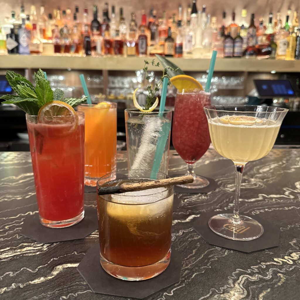 a group of mocktails on a marbled bar