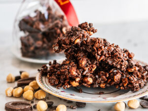 morini crunch - clumps of chocolate bark with hazlenuts sit on a tray